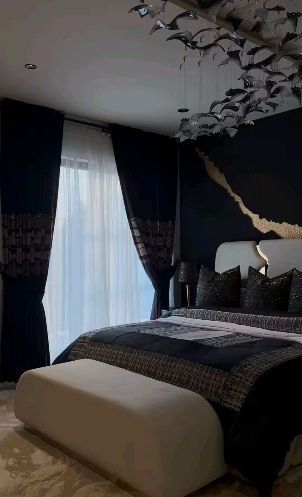A finished carved bed frame styled in a client's bedroom